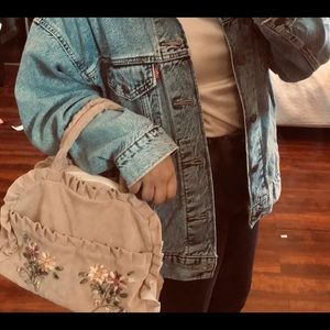 vintage handbag with flower embellishments